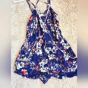 This romper is perfect for spring or summer with its vibrant colors!